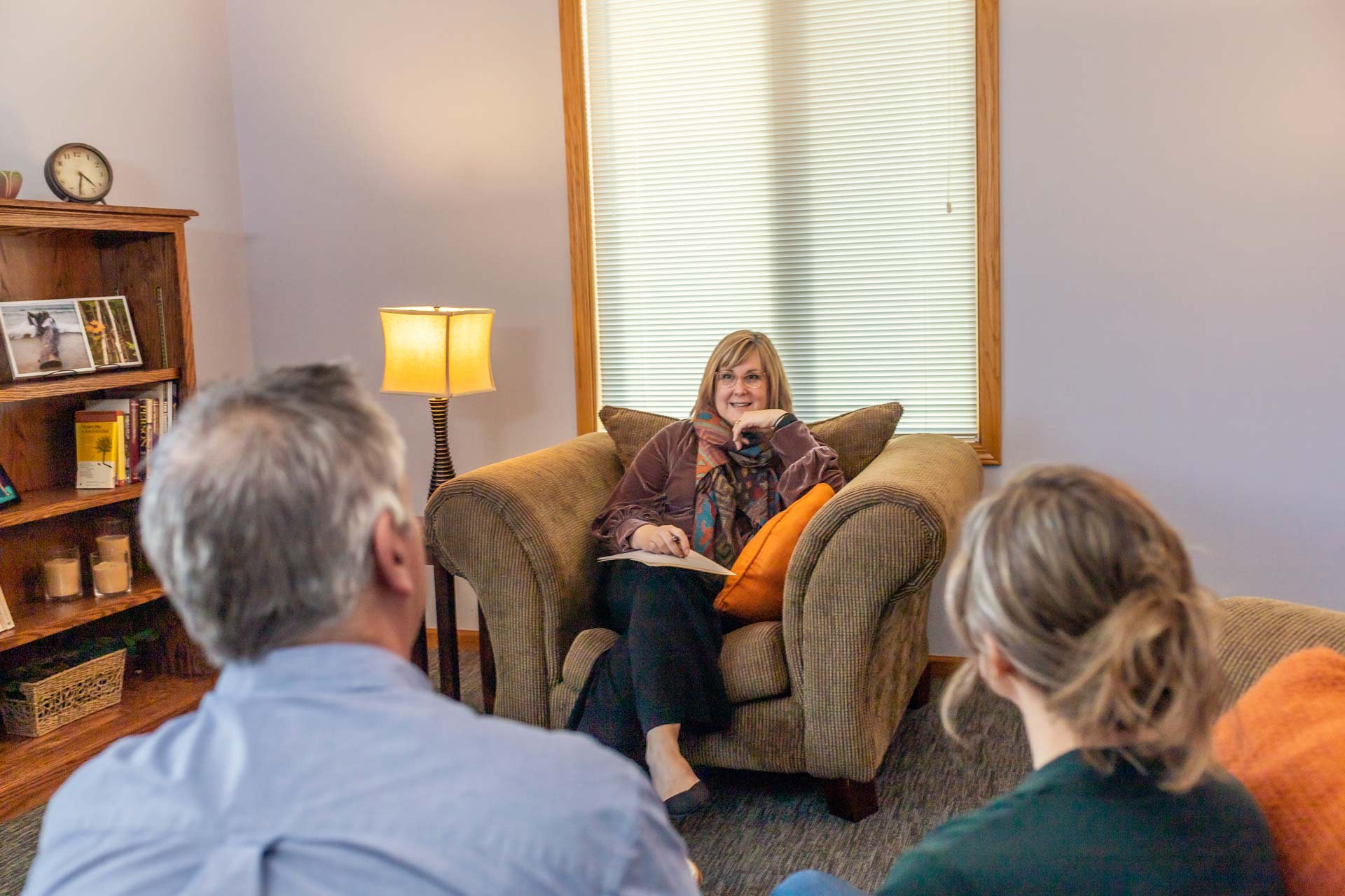 Jill counseling two patients